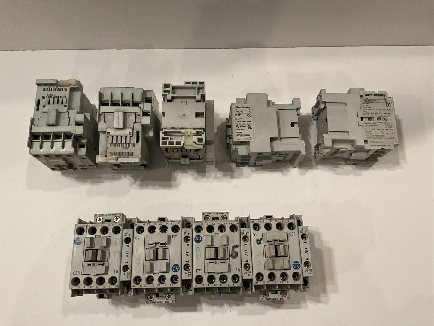 QTY 9 Allen-Bradley 100-C23*10 Series B along with AB 100S Series A pre-mounted