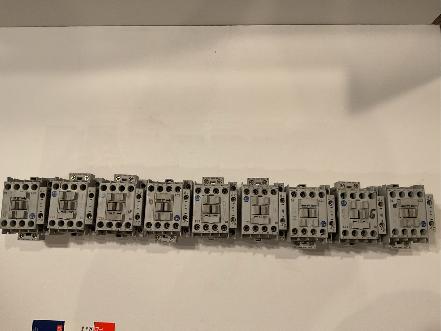 QTY 9 Allen-Bradley 100-C23*10 Series B along with AB 100S Series A pre-mounted